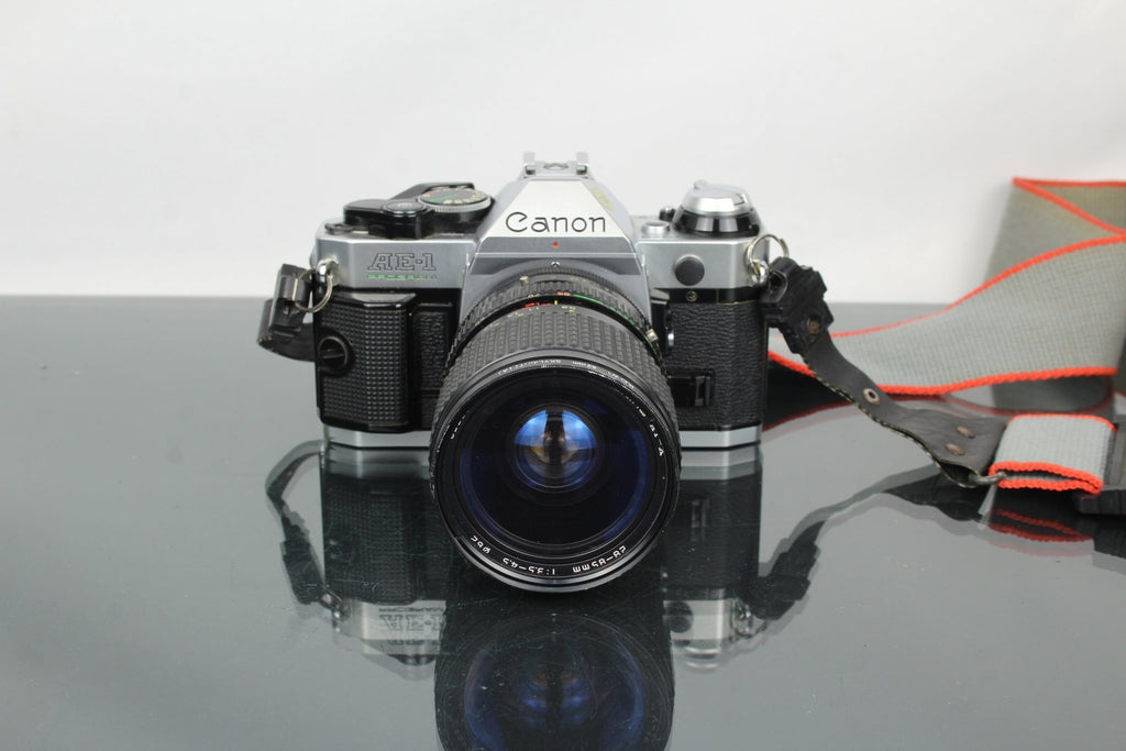 Canon AE - 1 Program + Tokina AT - X 28 - 85mm Canon FD mount lens - Dutch|Thrift